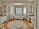 Relaxing bathroom with soaking tub, double vanities, and neutral décor at 1504 Ginger Snap, Deland, FL 32720