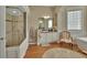 Elegant bathroom featuring a glass-enclosed shower, vanity with ample storage, and stylish decor at 1504 Ginger Snap, Deland, FL 32720
