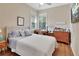 Well-lit bedroom with a cozy feel, featuring hardwood floors, and a lovely view at 1504 Ginger Snap, Deland, FL 32720