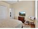 Cozy bedroom featuring neutral walls, television, closet, and a window with natural light at 1504 Ginger Snap, Deland, FL 32720