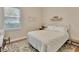 Comfortable and bright bedroom featuring hardwood floors, soft lighting, and a queen bed at 1504 Ginger Snap, Deland, FL 32720