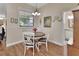 Charming dining area with wood floors and a view of the backyard at 1504 Ginger Snap, Deland, FL 32720