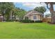 Attractive single-story home with stone accents, manicured landscaping, and a well-maintained lawn at 1504 Ginger Snap, Deland, FL 32720