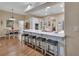 Modern kitchen with white cabinetry, granite countertops, and breakfast bar at 1504 Ginger Snap, Deland, FL 32720