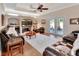 Comfortable living room with hardwood floors, fireplace, and large windows offering ample natural light at 1504 Ginger Snap, Deland, FL 32720