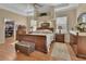 Spacious main bedroom featuring hardwood floors, tray ceilings, and a walk-in closet at 1504 Ginger Snap, Deland, FL 32720