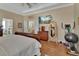 Comfortable main bedroom with hardwood floors, and a lovely home gym area at 1504 Ginger Snap, Deland, FL 32720