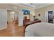 Spacious main bedroom with tray ceilings, hardwood floors, and ensuite bathroom at 1504 Ginger Snap, Deland, FL 32720