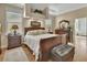 Spacious main bedroom with tray ceiling, wood floors, and ample natural light at 1504 Ginger Snap, Deland, FL 32720