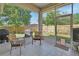 Enclosed sunroom with tile flooring and a view of the backyard at 1504 Ginger Snap, Deland, FL 32720