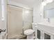 Bathroom features white tile shower, modern vanity, new fixtures and updated toilet at 1534 Center St, Deland, FL 32720