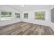 Sunroom with lots of natural light, wood-look flooring, and scenic views at 1534 Center St, Deland, FL 32720