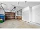 Bright garage space with ample room for storage, featuring a wooden workbench and shelving at 1534 Center St, Deland, FL 32720