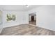 Bonus room with access to a brick fireplace and wood look floors at 1534 Center St, Deland, FL 32720