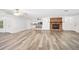 Spacious living room featuring wood flooring and a fireplace at 1534 Center St, Deland, FL 32720