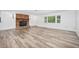 Spacious living room featuring wood flooring and a fireplace at 1534 Center St, Deland, FL 32720