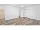 Spacious main bedroom with wood-look flooring, a ceiling fan, and a closet for storage at 1534 Center St, Deland, FL 32720