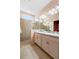 Elegant bathroom with double vanity, granite countertop, and walk-in shower at 1613 Lady Fern Trl, Deland, FL 32720