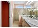 Elegant bathroom featuring dual sinks, granite countertops, and a tiled shower at 1613 Lady Fern Trl, Deland, FL 32720