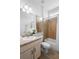 Well-lit bathroom featuring a vanity, sink, and a shower-tub combination at 1613 Lady Fern Trl, Deland, FL 32720