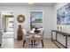 Cozy breakfast nook with a charming table, two chairs, and poolside views through the window at 1613 Lady Fern Trl, Deland, FL 32720