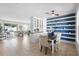 Inviting dining area with decorative shelving and an open concept leading to the living spaces at 1613 Lady Fern Trl, Deland, FL 32720