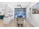 Bright dining room with tiled floors, a ceiling fan, shelving with decor, and an art piece at 1613 Lady Fern Trl, Deland, FL 32720