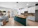 Well-lit kitchen with an island, modern fixtures, and a seamless transition to the adjacent living area at 1613 Lady Fern Trl, Deland, FL 32720