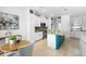 Open-concept kitchen featuring a large center island, modern appliances, and adjacent breakfast nook at 1613 Lady Fern Trl, Deland, FL 32720