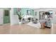 A living room with a white rug, modern furniture, and a view into the kitchen at 1613 Lady Fern Trl, Deland, FL 32720