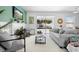 Cozy living room with a fireplace, comfortable seating, and sliding glass doors to the outdoor space at 1613 Lady Fern Trl, Deland, FL 32720