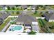 Aerial view of a home's backyard featuring a pool, landscaped garden, and outdoor living space at 1613 Lady Fern Trl, Deland, FL 32720