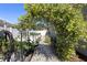 Lush yard featuring a shaded archway over a gravel path at 1613 Lady Fern Trl, Deland, FL 32720