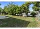 Spacious backyard with a shed and mature trees at 1627 Alloway Dr, Deltona, FL 32738