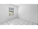 Bright bedroom with tile flooring and a window offering natural light at 1627 Alloway Dr, Deltona, FL 32738