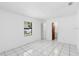 Bright bedroom with tile flooring and large window at 1627 Alloway Dr, Deltona, FL 32738