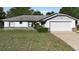Charming single-story home with attached garage and well-maintained front lawn at 1627 Alloway Dr, Deltona, FL 32738