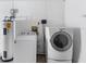 Laundry room with washer, dryer, and water heater at 1627 Alloway Dr, Deltona, FL 32738