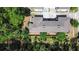 Aerial view of the home showing roof and surrounding trees at 1655 Pham Dr, Port Orange, FL 32129