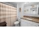 A well-lit bathroom featuring a shower, toilet, vanity, and decorative nautical elements at 1655 Pham Dr, Port Orange, FL 32129