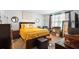 A spacious bedroom with a decorative gold comforter, side tables, and tasteful decor at 1655 Pham Dr, Port Orange, FL 32129