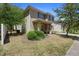 Attractive two-story home featuring classic shutters and a cozy, covered front entryway at 1655 Pham Dr, Port Orange, FL 32129