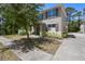 Charming two-story home featuring a covered front porch and manicured landscaping at 1655 Pham Dr, Port Orange, FL 32129