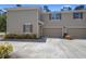 Spacious home features a two-car garage and a well-kept lawn at 1655 Pham Dr, Port Orange, FL 32129