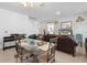 Inviting living room with neutral tile flooring and a stylish glass top dining table at 1655 Pham Dr, Port Orange, FL 32129