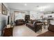 Open-concept living space with comfortable seating, dining area, and access to a modern kitchen at 1655 Pham Dr, Port Orange, FL 32129