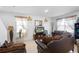 Comfortable living room featuring neutral-toned furniture, decorative accents, and natural light at 1655 Pham Dr, Port Orange, FL 32129