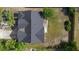 Aerial view of the home showcasing the roof, yard, and surrounding landscape at 1842 W Cooper Dr, Deltona, FL 32725