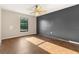 Bedroom with large window and ceiling fan at 1842 W Cooper Dr, Deltona, FL 32725