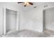 Bright bedroom with a ceiling fan and a closet with bi-fold doors at 1842 W Cooper Dr, Deltona, FL 32725